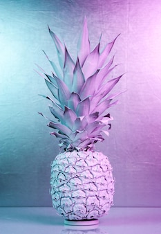 Ananas in vibrant bold gradient holographic colors in a creative concept art style.