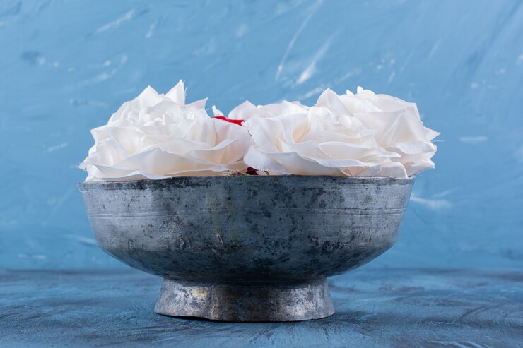 Free Photo an ancient bowl with white beautiful fresh roses .