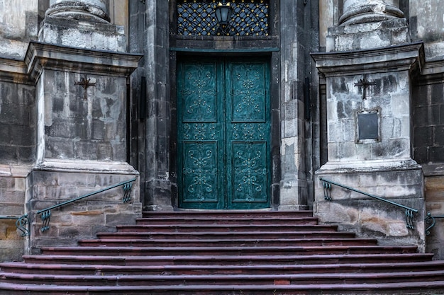 Ancient doors in the cathedral turquoise old doors