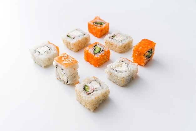 Free photo angle view arranged sushi rolls