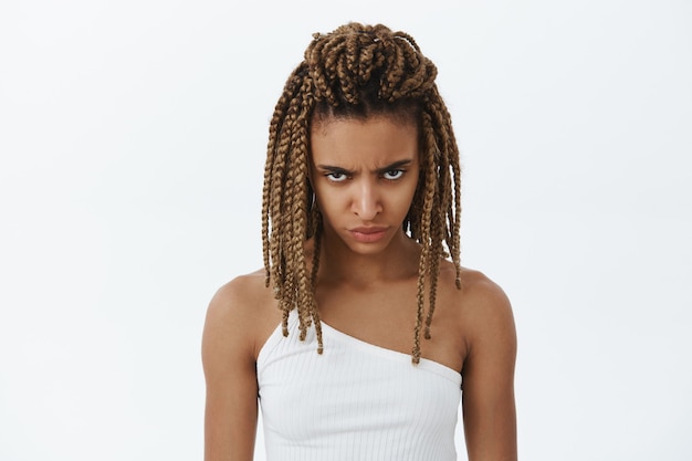 Angry african-american girl looking with scorn and despise