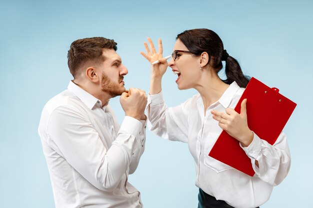 Angry boss. Woman and his secretary standing at office. Businesswoman screaming to his colleague. Female and male caucasian models. Office relationships concept, Human emotions