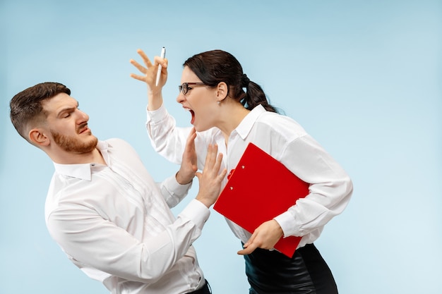 Angry boss. Woman and his secretary standing at office or . Businesswoman screaming to his colleague