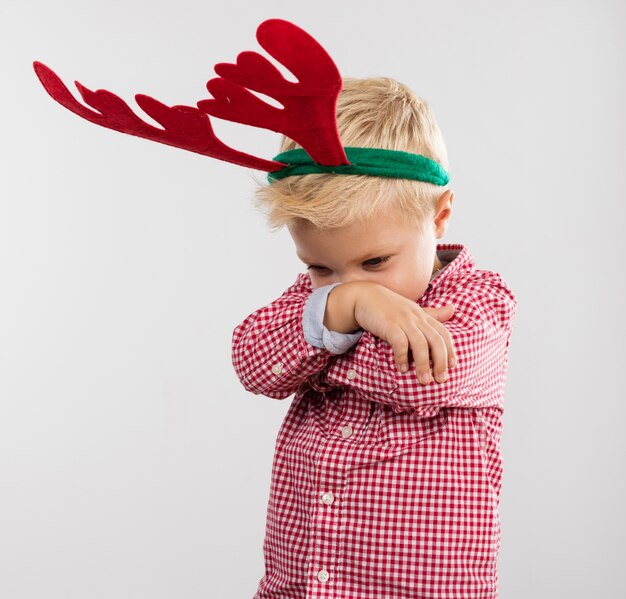 Angry boy with reindeer antlers