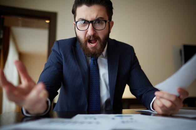 Angry businessman with glasses
