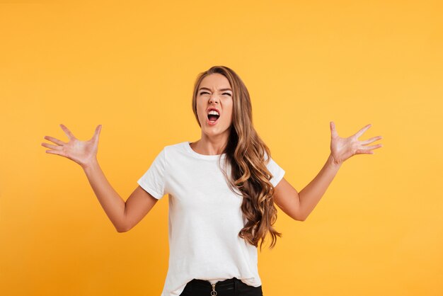 Angry caucasian woman standing near copyspace