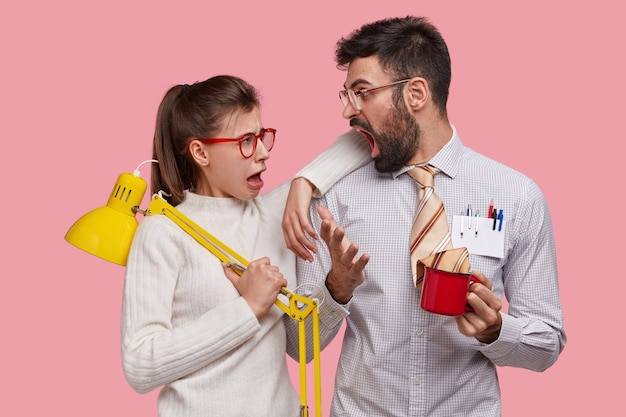 Free photo angry husband shouts at wife while discuss family business