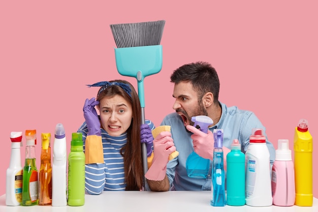 Angry man from cleaning service shouts at woman for bad work