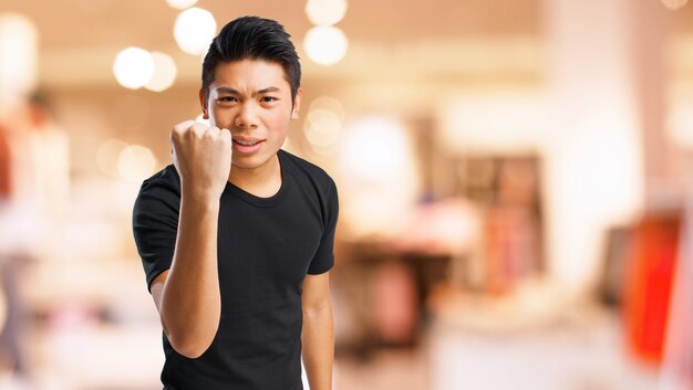 Angry man with a raised fist