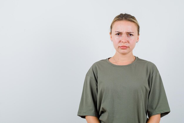 The angry woman is looking at camera  on white background