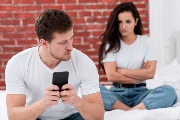 Angry woman looking at her boyfriend