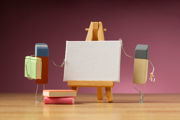 Free photo animated eraser painting on blank easel still life