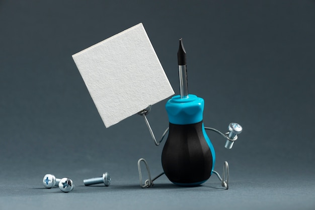 Free photo animated screwdriver with screw and banner still life