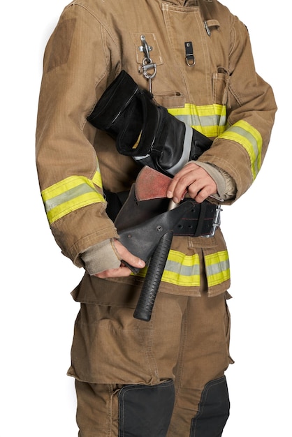 Anonymous firefighter pulling hammer from leather holster