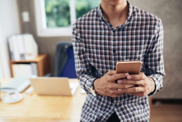 Anonymous man using smartphone