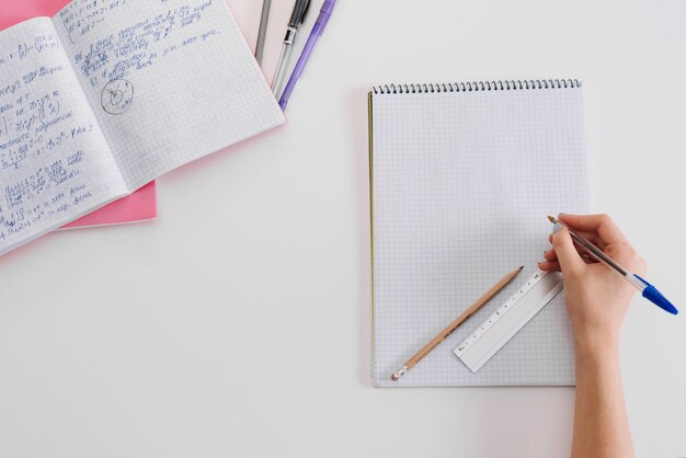 Anonymous student posing with notepads