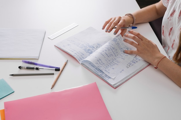 Anonymous student with notebooks