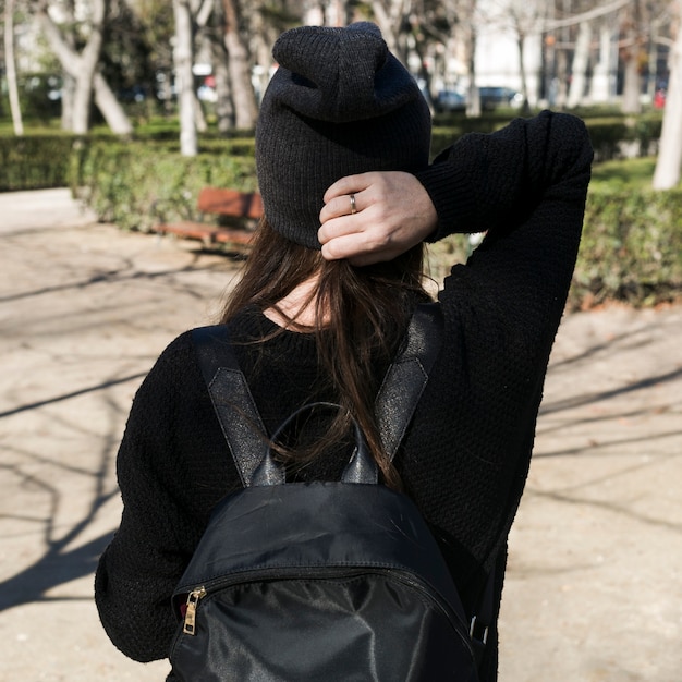 Anonymous trendy woman in black