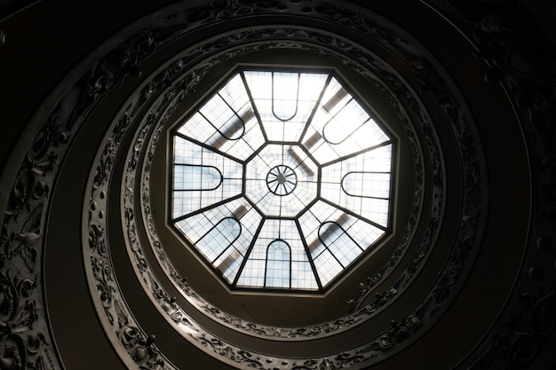 Antique spiral stairs and the glass ceiling in the Vatican museum, Rome, Italy
