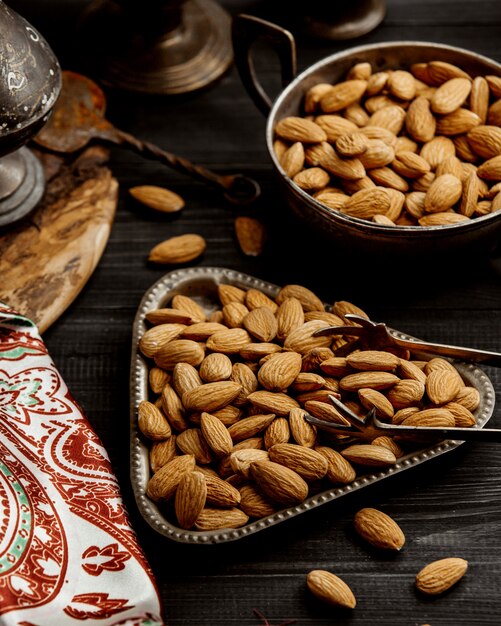 An antique triangular bowl of almond