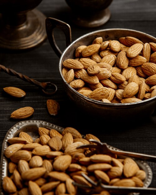 An antique triangular and round bowls of almond