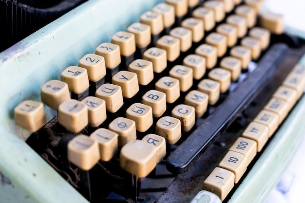 Antique typewriter cyrillic keys close up and russian keys selective focus