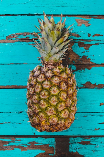 Antique wooden surface with pineapple