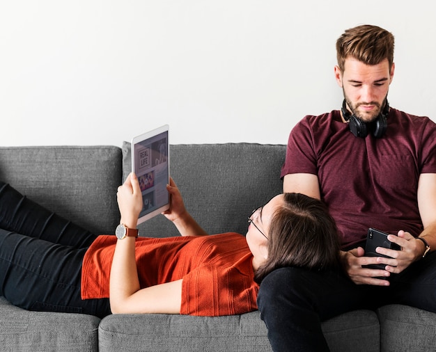 Antisocial couple relaxing on the sofa