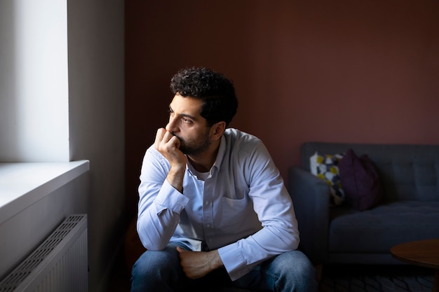 Anxious man indoors front view