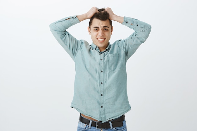 Free photo anxious overwhelmed adult coworker in casual shirt