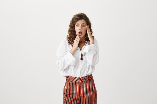 Anxious panicking woman looking alarmed, having trouble