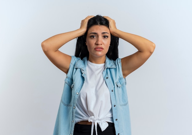 Free photo anxious young caucasian woman holds head