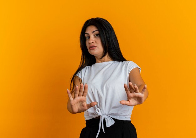 Anxious young caucasian woman stretching out hands