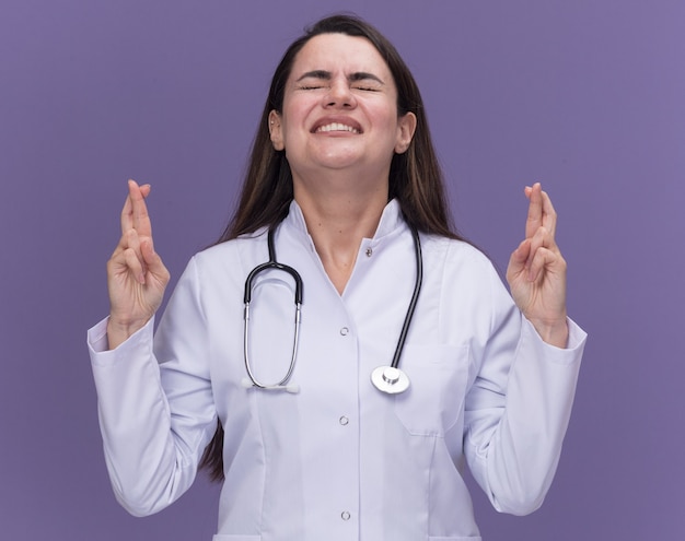 Free Photo | Anxious young female doctor wearing medical robe with ...