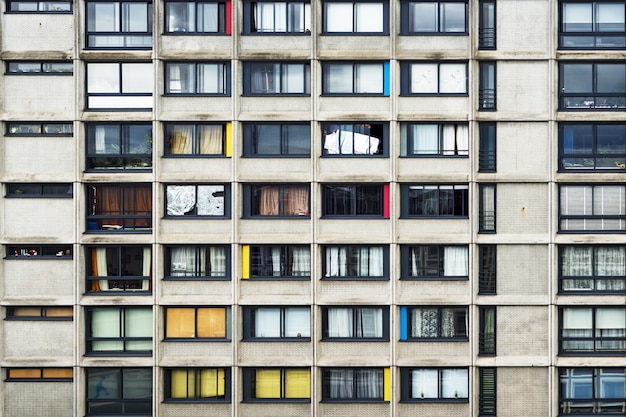 Apartment building with pinches of color in the middle of the city