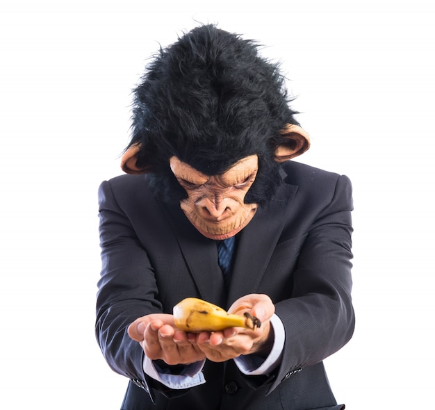 Free photo ape man offering a banana