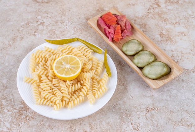 Appetizer and main course on marble surface