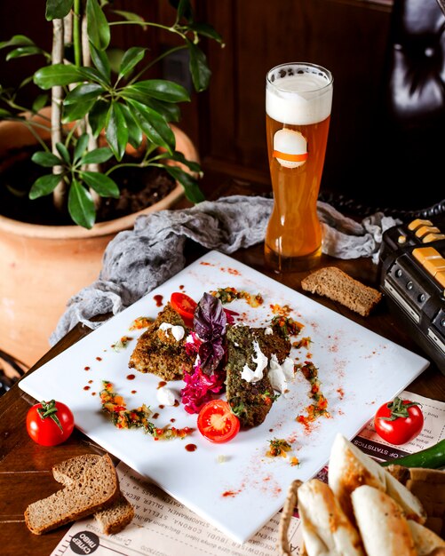 Appetizer served with glass of beer