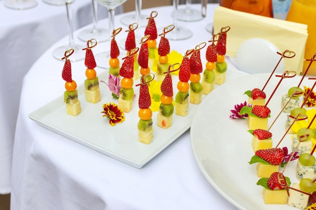 Appetizers gourmet food canape with cheese and strawberries blueberries catering service