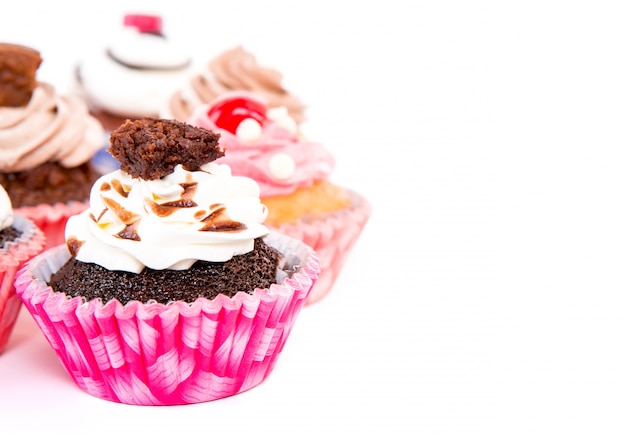 Appetizing chocolate cupcakes with cream