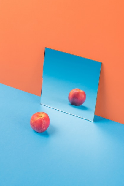 Apple on blue table isolated on orange