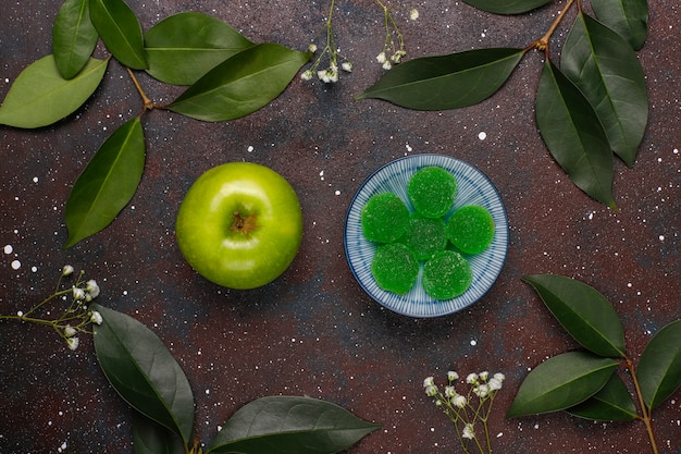 Apple green marmalade candy in sugar. Healthy dessert for gourmets.