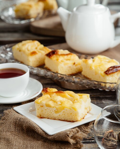 Apple pie slice served with black tea