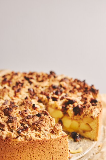 Apple pie topped with crumble and roasted nuts