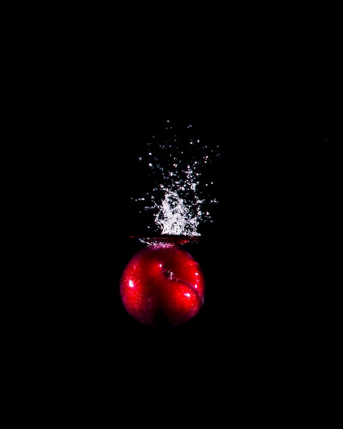 Apple plunging into the water