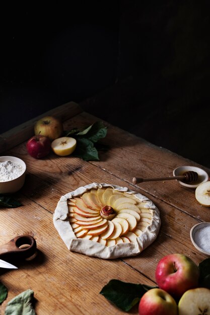 Apple slices on dough high angle