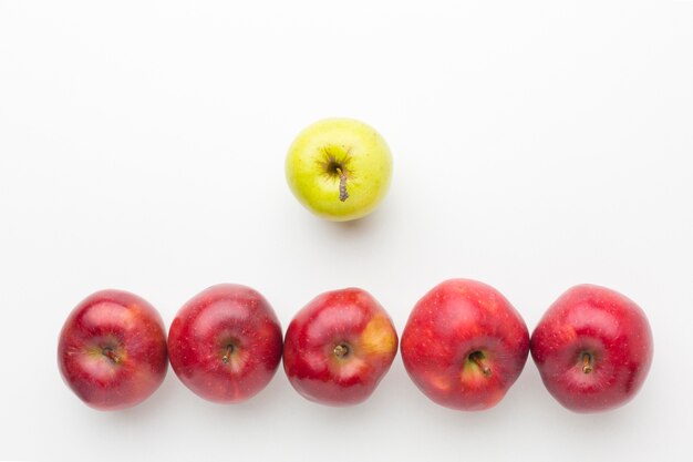 Apples aligned on table