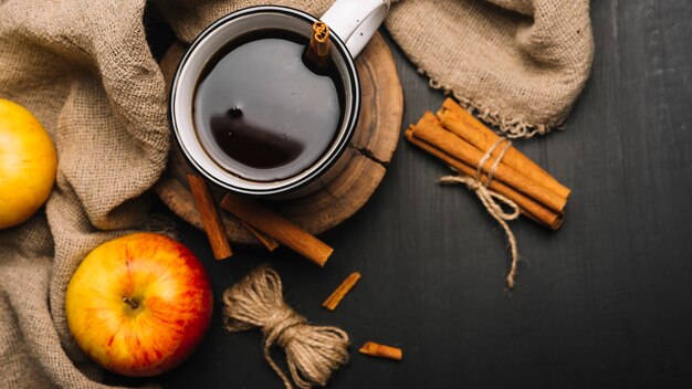 Apples and fabric around spiced drink