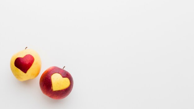 Apples with fruit heart shapes and copy space