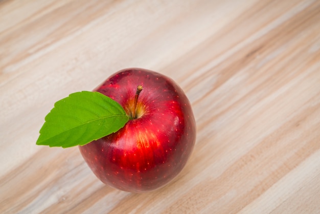 Apples on  wood background .